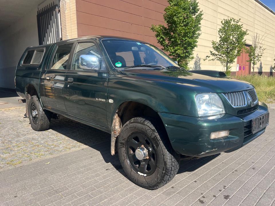 Купити потужне  авто з ЄвропиMitsubishi L200 2.5 TD  пробіг: 330000 рік: Dezember 2005 Diesel потужність:116 PS коробка: Manuell ціна: 5750 - Фото 2