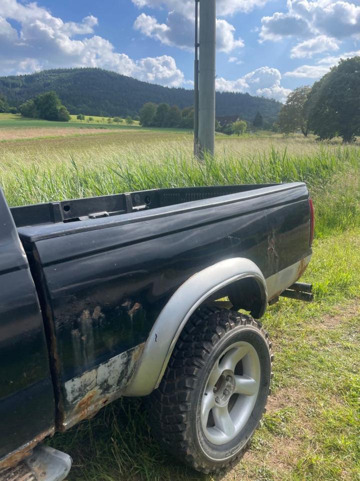 Nissan Navara D22 KingCab Pickup пробіг: 180000 рік: Juli 2000 Diesel потужність:103 PS коробка: Manuell ціна: 4999 Schwarz - Фото 10