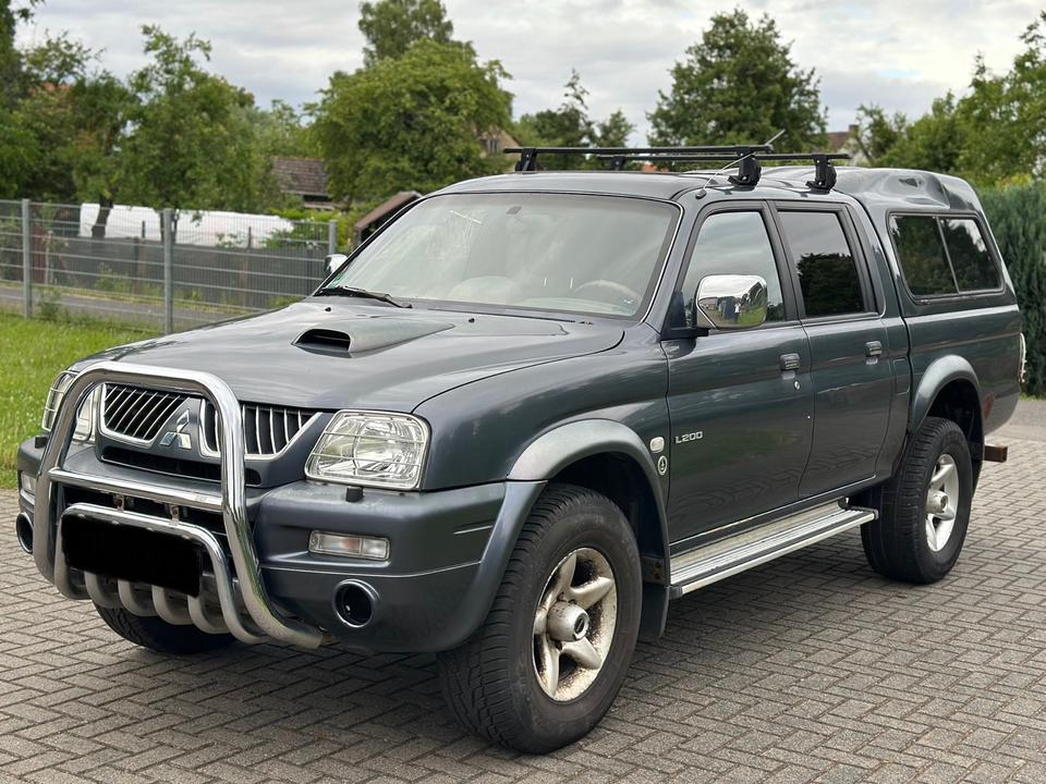 Mitsubishi L200 2.5 Dakar пробіг: 176000 рік: Juli 2005 Diesel коробка: Manuell ціна: 5700 Grau - Фото 1