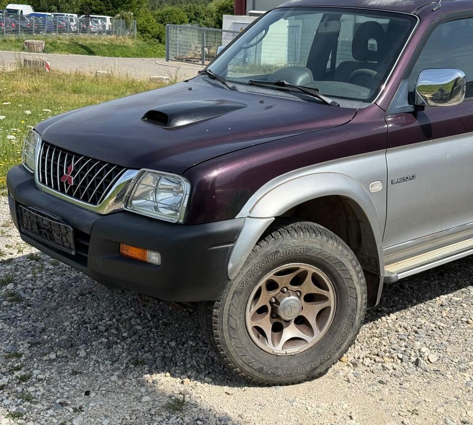 Надійне авто для військових Mitsubishi L200 Pick-Up Double Cab 2.5TD 4x4 American Sport пробіг: 231000 рік: Mai 2002 Diesel потужність:116 PS ціна: 4800 - Фото 6