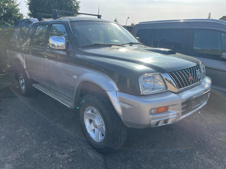 Mitsubishi L200 2.5 TD  L-Reihe пробіг: 214859 рік: März 2003 Diesel потужність:116 PS коробка: Manuell ціна: 5999 - Фото 0