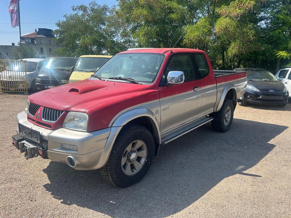  Дпомога з купівлі та пригону надійного авто Mitsubishi L200 TD Intense Club Cab 2500  пробіг: 270000 рік: März 2005 Diesel потужність:116 PS коробка: Manuell ціна: 3000 - Фото 0