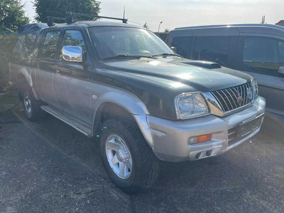 Mitsubishi L200 2.5 TD  L-Reihe пробіг: 214859 рік: März 2003 Diesel потужність:116 PS коробка: Manuell ціна: 5999